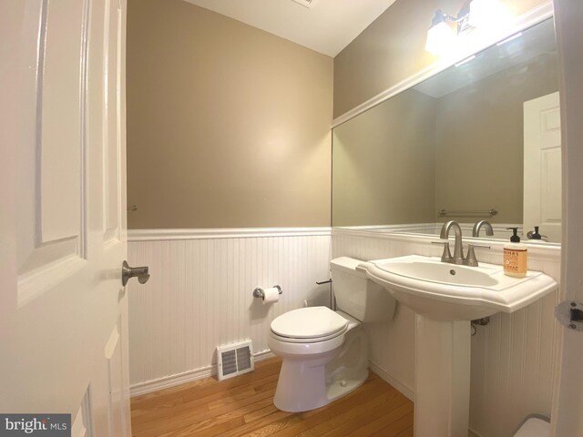 97 Kirkwood Dr, Newtown, PA 18940 - bathroom with wood finished floors, visible vents, a wainscoted wall, and toilet