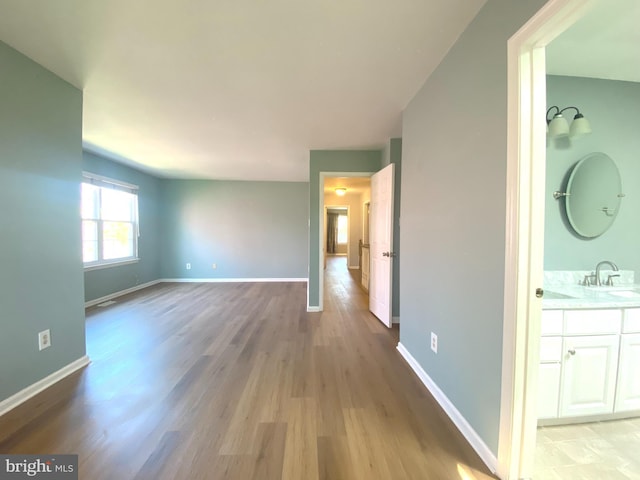 97 Kirkwood Dr, Newtown, PA 18940 - interior space with light wood-style flooring, baseboards, and a sink