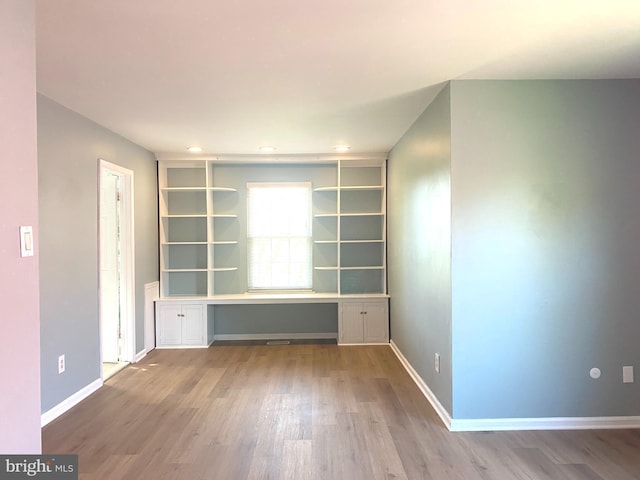 97 Kirkwood Dr, Newtown, PA 18940 - spare room featuring baseboards, wood finished floors, and built in desk