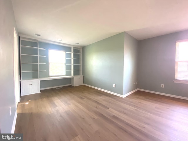 97 Kirkwood Dr, Newtown, PA 18940 - empty room with baseboards, built in features, and wood finished floors
