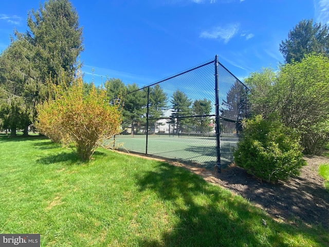 97 Kirkwood Dr, Newtown, PA 18940 - view of tennis court with a lawn and fence