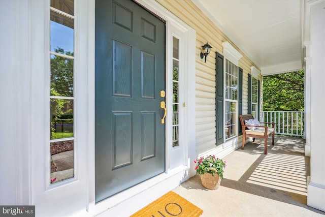 property entrance featuring covered porch