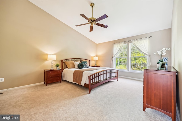 bedroom featuring carpet flooring, a ceiling fan, baseboards, and lofted ceiling