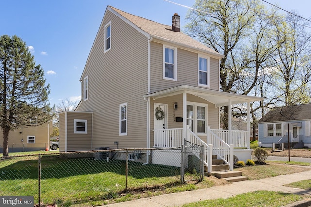 1217 Chestnut St, Burlington, NJ 08016 - traditional style home with a front yard, a fenced front yard, a chimney, and covered porch
