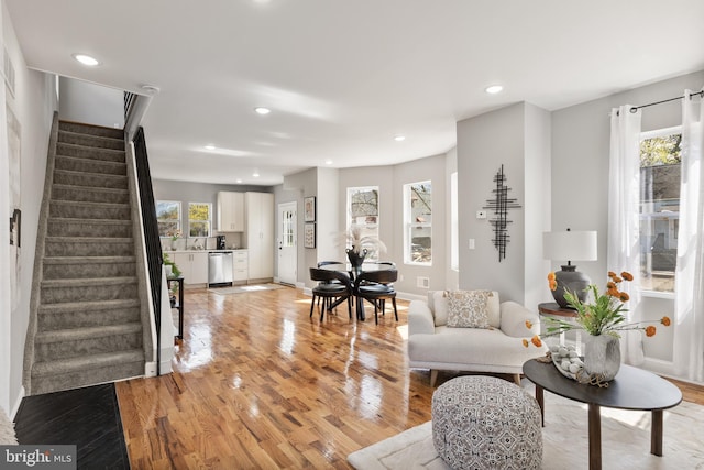 1217 Chestnut St, Burlington, NJ 08016 - living room featuring recessed lighting, stairway, light wood-type flooring, and a healthy amount of sunlight