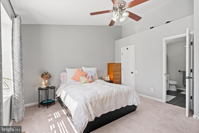 11200 Rienzi Pl Unit 201, Manassas, VA 20109 - carpeted bedroom with a towering ceiling, baseboards, connected bathroom, and ceiling fan