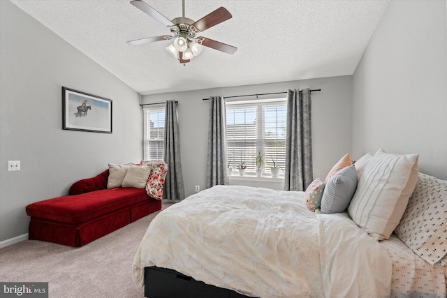 11200 Rienzi Pl Unit 201, Manassas, VA 20109 - bedroom with a textured ceiling, vaulted ceiling, baseboards, light colored carpet, and ceiling fan