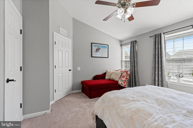 11200 Rienzi Pl Unit 201, Manassas, VA 20109 - bedroom featuring vaulted ceiling, visible vents, carpet, and a textured ceiling