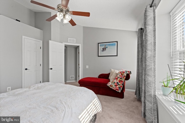 11200 Rienzi Pl Unit 201, Manassas, VA 20109 - carpeted bedroom with baseboards, visible vents, high vaulted ceiling, and ceiling fan