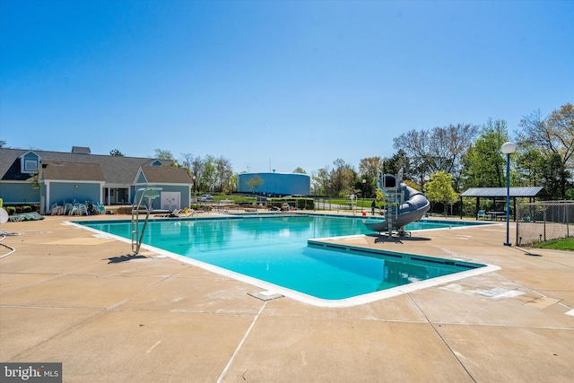 11200 Rienzi Pl Unit 201, Manassas, VA 20109 - community pool with a water slide, a patio, and fence