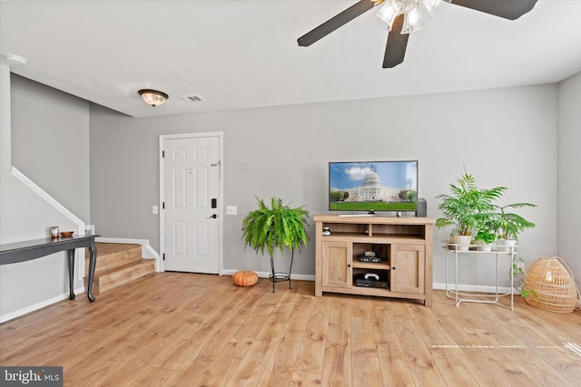 11200 Rienzi Pl Unit 201, Manassas, VA 20109 - living area with stairs, light wood-type flooring, ceiling fan, baseboards, and visible vents