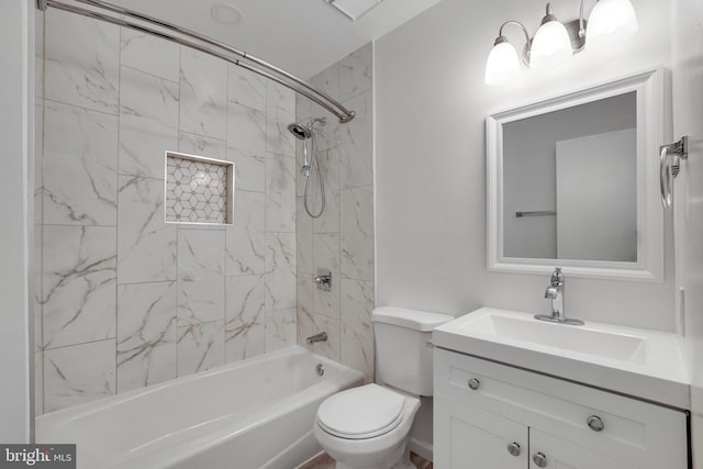 bathroom featuring vanity, washtub / shower combination, and toilet