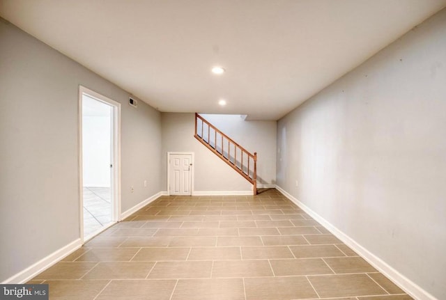 unfurnished room with recessed lighting, stairs, visible vents, and baseboards