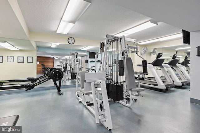 gym with a textured ceiling