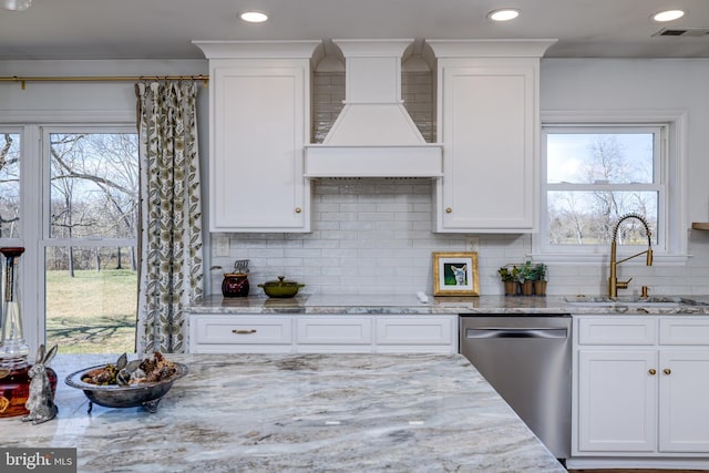 901 Riverside Ave, Grottoes, VA 24441 - kitchen with visible vents, white cabinets, a sink, premium range hood, and stainless steel dishwasher