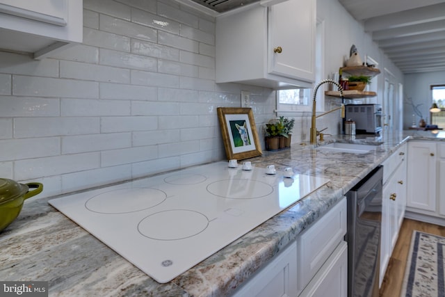 901 Riverside Ave, Grottoes, VA 24441 - kitchen featuring white electric cooktop, light stone counters, white cabinetry, dishwasher, and a sink