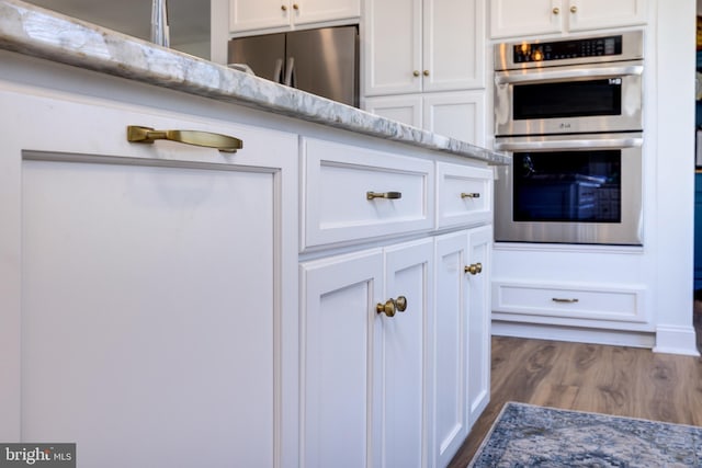 901 Riverside Ave, Grottoes, VA 24441 - room details with white cabinetry, light stone countertops, and stainless steel appliances