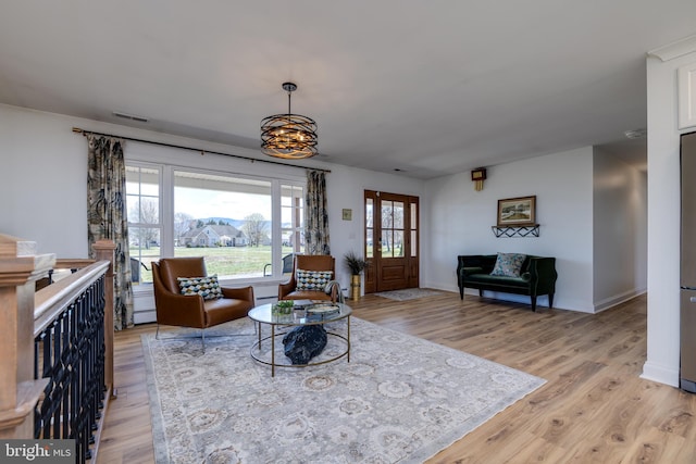 901 Riverside Ave, Grottoes, VA 24441 - living room featuring light wood-style flooring, baseboards, and visible vents