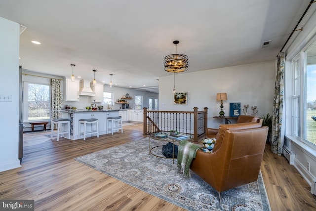 901 Riverside Ave, Grottoes, VA 24441 - living room featuring light wood-style flooring, baseboards, and recessed lighting