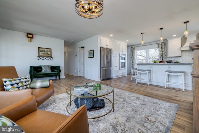 901 Riverside Ave, Grottoes, VA 24441 - living area featuring a chandelier, recessed lighting, baseboards, and wood finished floors