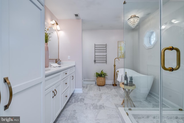 901 Riverside Ave, Grottoes, VA 24441 - bathroom featuring a shower with shower door, a freestanding tub, a sink, a baseboard radiator, and double vanity
