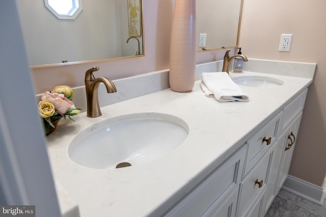 901 Riverside Ave, Grottoes, VA 24441 - bathroom with a sink, double vanity, and tile patterned flooring