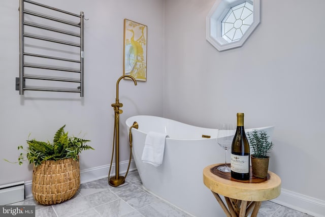 901 Riverside Ave, Grottoes, VA 24441 - full bath featuring a freestanding bath, radiator heating unit, and baseboards