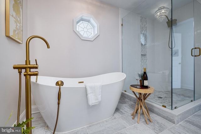 901 Riverside Ave, Grottoes, VA 24441 - full bathroom with a stall shower, baseboards, and a freestanding bath