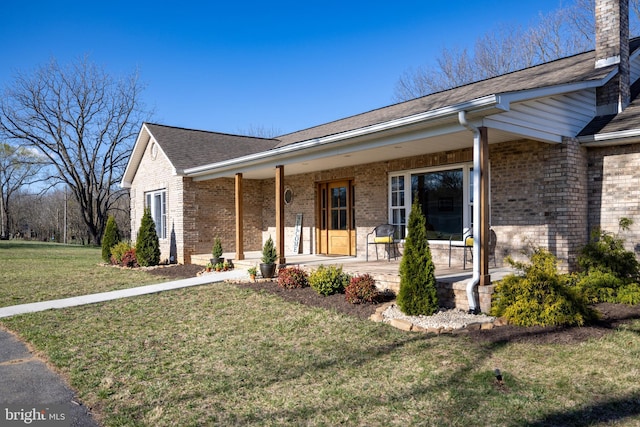 901 Riverside Ave, Grottoes, VA 24441 - single story home featuring a porch, roof with shingles, a front yard, brick siding, and a chimney