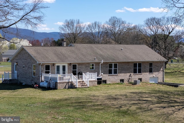 901 Riverside Ave, Grottoes, VA 24441 - back of property featuring central air condition unit, a chimney, a deck with mountain view, and a yard