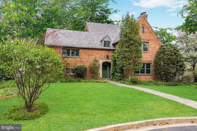 2709 Mckinley St NW, Washington, DC 20015 - view of front of property with a front yard, brick siding, and a chimney