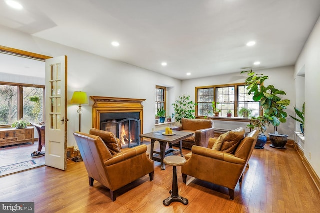 2709 Mckinley St NW, Washington, DC 20015 - living area with a lit fireplace, hardwood / wood-style floors, a healthy amount of sunlight, and recessed lighting