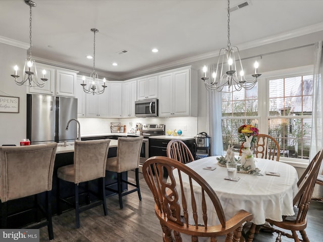 dining room with ornamental molding, visible vents, recessed lighting, dark wood-style flooring, and a notable chandelier