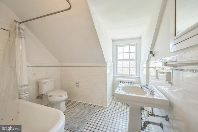full bathroom featuring toilet, tile walls, tile patterned flooring, and a shower with curtain