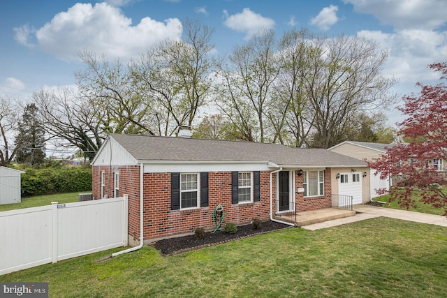 single story home featuring a front lawn, concrete driveway, fence, brick siding, and a garage