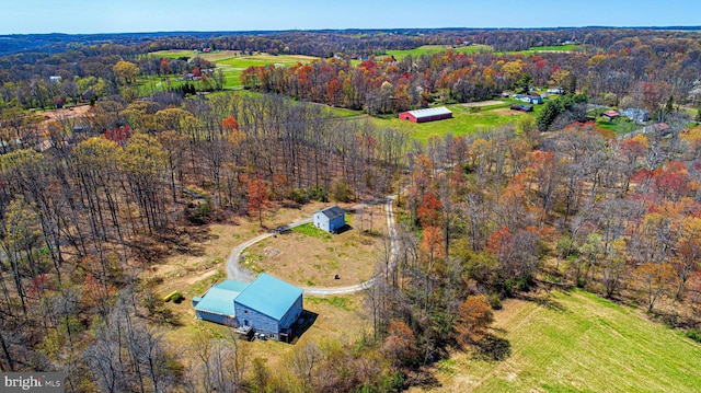 bird's eye view featuring a forest view