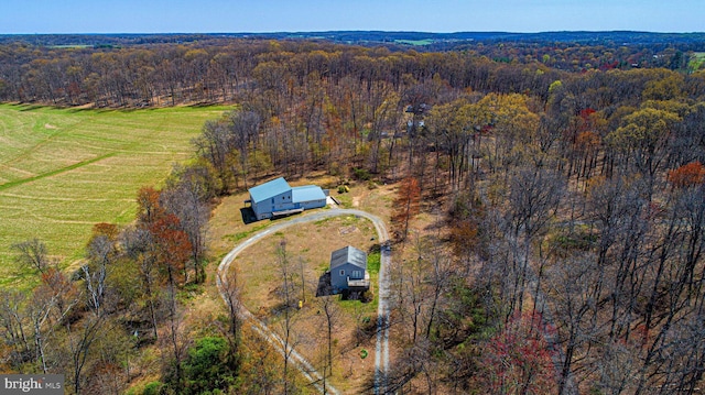 bird's eye view with a rural view and a forest view