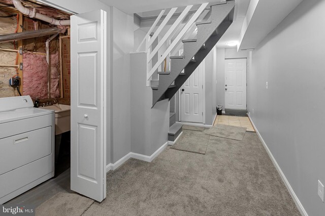 3417 Edmondson Ave, Baltimore, MD 21229 - basement featuring baseboards, light colored carpet, and washer / dryer