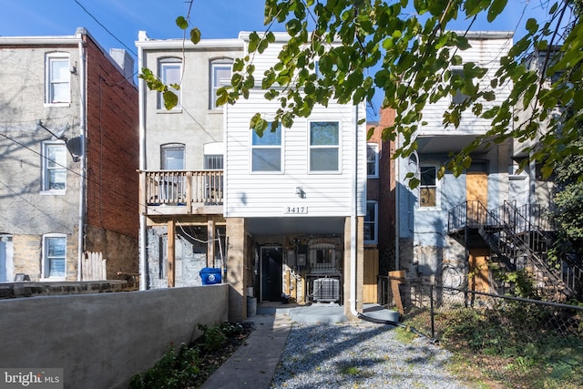 3417 Edmondson Ave, Baltimore, MD 21229 - view of front of home featuring fence, a carport, and stairway