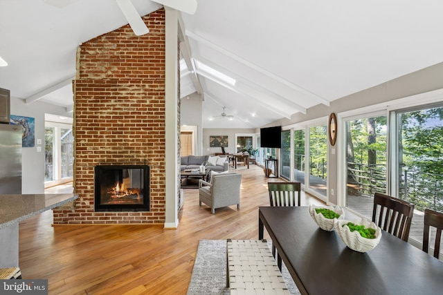 3 Steffen Point Hts, Annapolis, MD 21401 - dining room with light wood finished floors, a brick fireplace, plenty of natural light, and a skylight