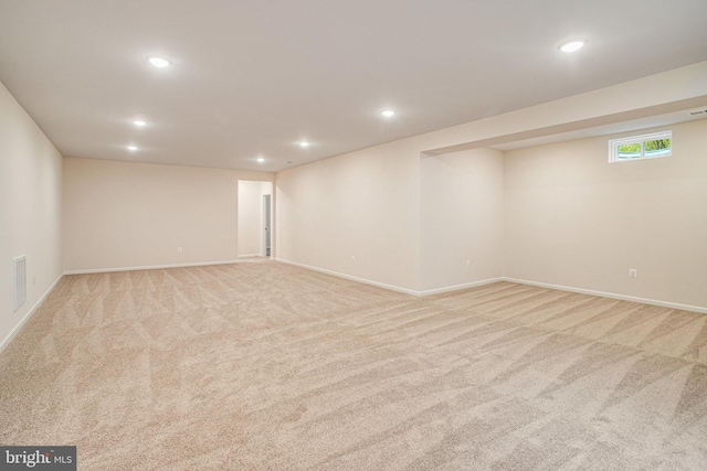 basement with baseboards, recessed lighting, and carpet