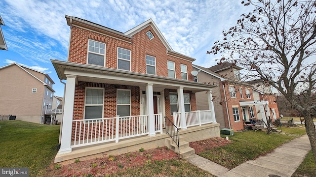 5502 Frankford Estates Dr, Baltimore, MD 21206 - view of front of home featuring brick siding, a front lawn, and covered porch