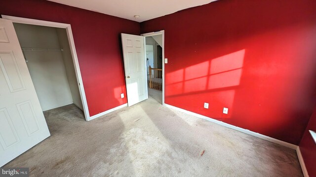 5502 Frankford Estates Dr, Baltimore, MD 21206 - unfurnished bedroom featuring a closet, baseboards, and carpet flooring