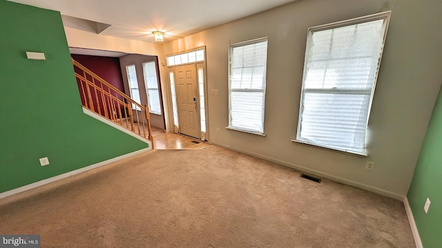5502 Frankford Estates Dr, Baltimore, MD 21206 - entryway with stairway, baseboards, visible vents, and carpet floors