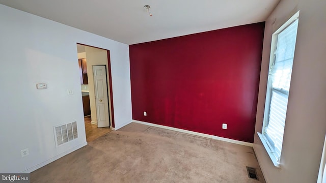 5502 Frankford Estates Dr, Baltimore, MD 21206 - unfurnished room featuring baseboards, carpet, and visible vents