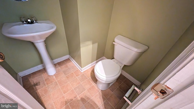 5502 Frankford Estates Dr, Baltimore, MD 21206 - bathroom with toilet, baseboards, and walk in shower