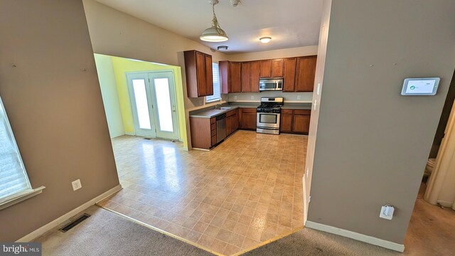 5502 Frankford Estates Dr, Baltimore, MD 21206 - kitchen with visible vents, baseboards, a sink, stainless steel appliances, and pendant lighting