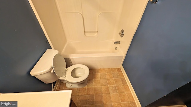 5502 Frankford Estates Dr, Baltimore, MD 21206 - bathroom featuring toilet, shower / tub combination, tile patterned flooring, and baseboards