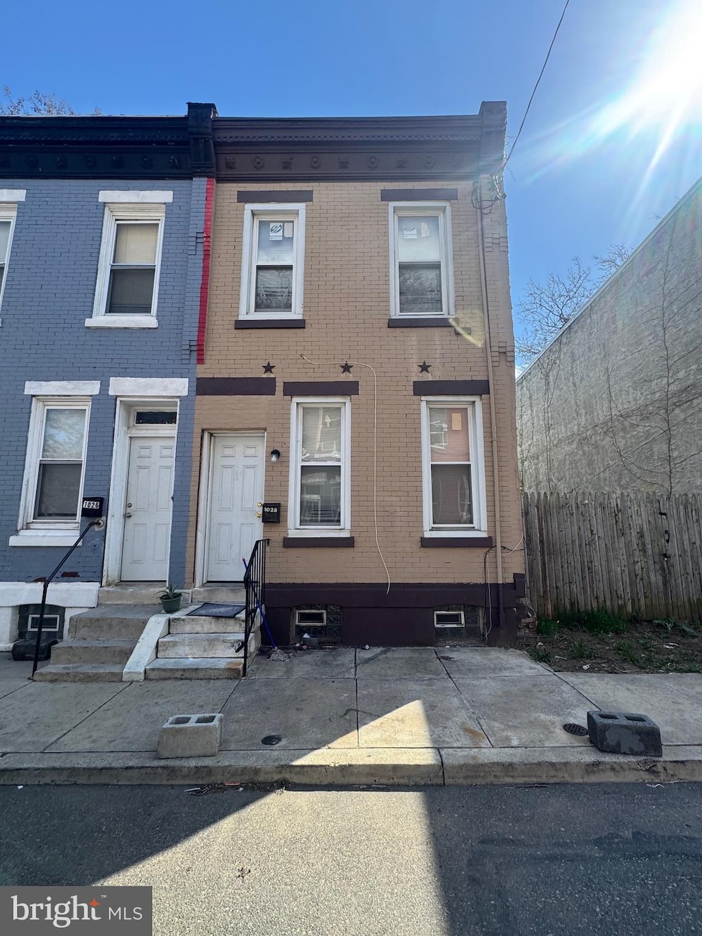 multi unit property with fence and brick siding