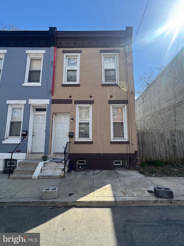 multi unit property with fence and brick siding